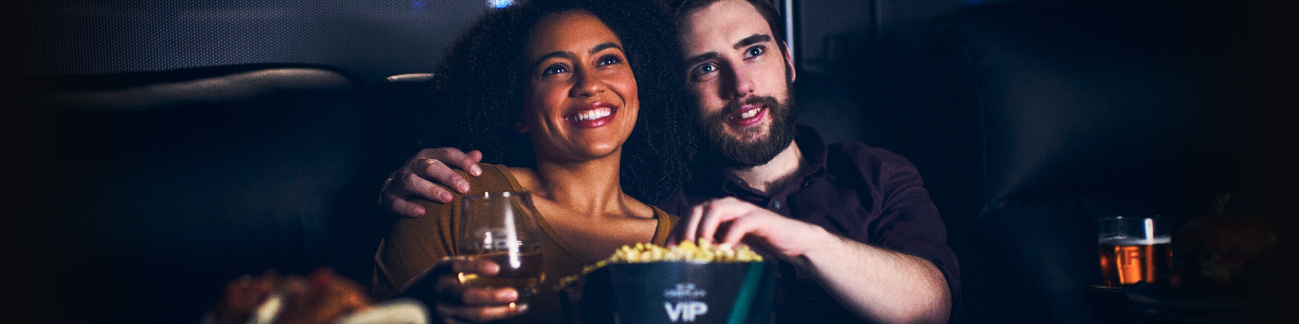 A couple watching a movie at VIP Cinemas.
