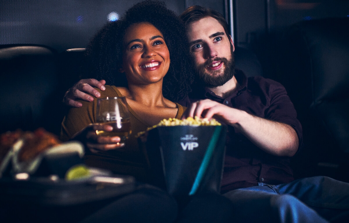 A couple watching a movie at VIP Cinemas.